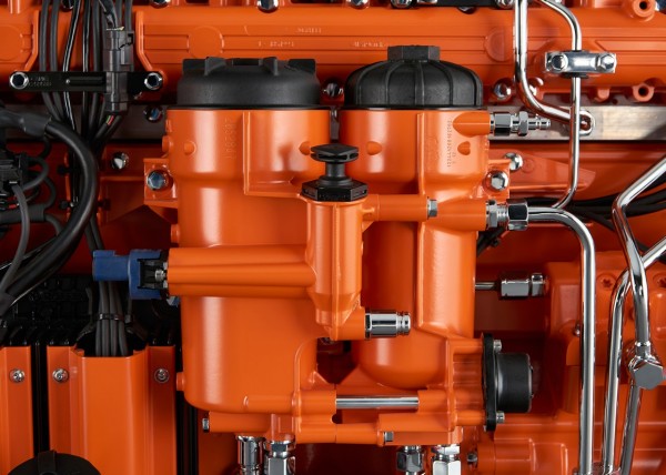 Scania orange engine with hose attached