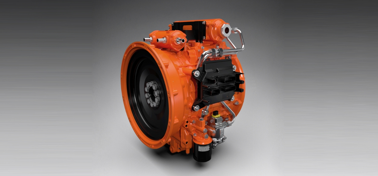 Close-up of a Scania electrified power system engine in orange and black colors.